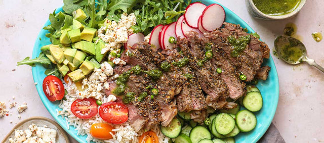 Indian Spiced Peppery Cumin New York Steak with colorful salad