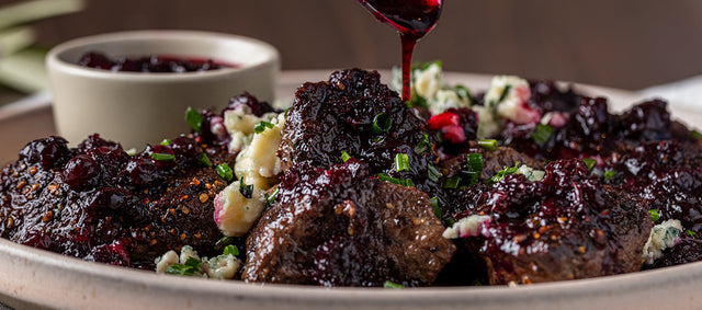 Black Pepper-Crusted Venison Medallions With Huckleberry Sauce