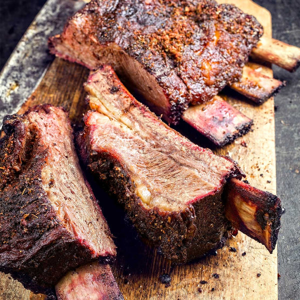 Cooked Beef Short Ribs placed on top of chopping board