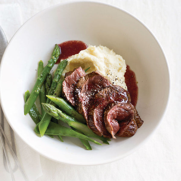 Roast Venison with Boysenberry Sauce served with asparagus and parsnip puree