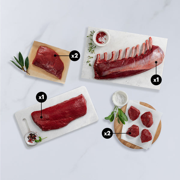 Assorted venison meats on a white surface with labels indicating quantities.
